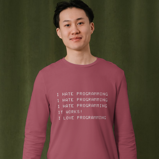 Person wearing a maroon shirt with text on a green background