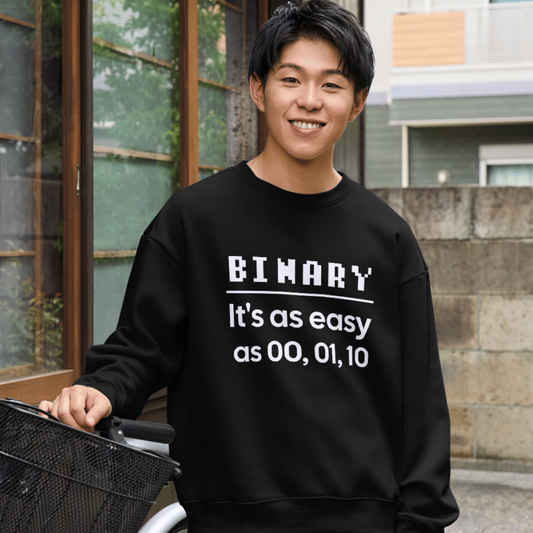 Person wearing a black shirt with text, standing outdoors.