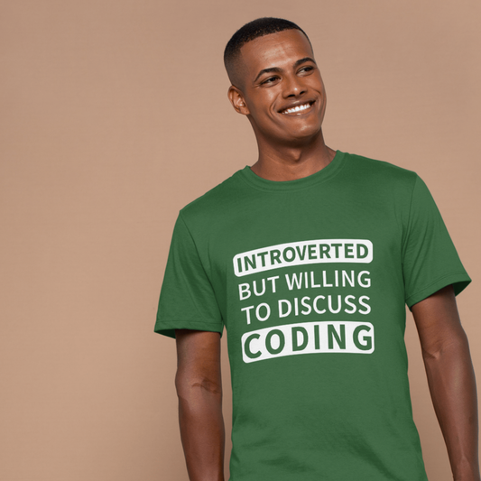 Man wearing a green t-shirt with "introverted but willing to discuss coding" on a beige background