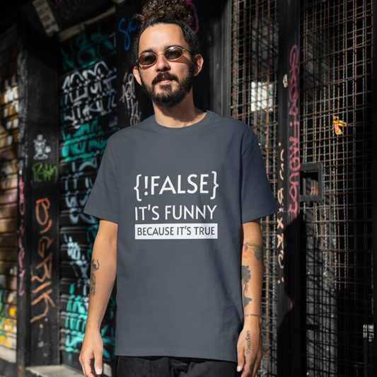 Man wearing a t-shirt with text "!FALSE It's funny because it's true" in an urban setting
