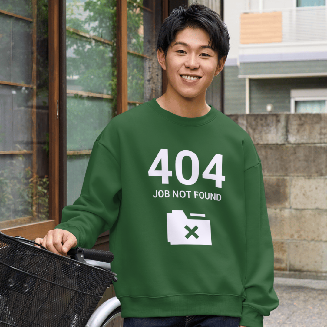 Person wearing a green shirt with '404 Job Not Found' design, standing outdoors.