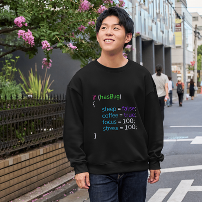 Person wearing a black shirt with colorful code text on a city street