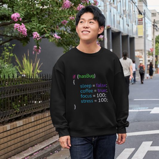Person wearing a black shirt with colorful code text on a city street