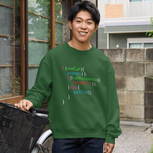 Person wearing a green sweatshirt with code-style text, standing outdoors.