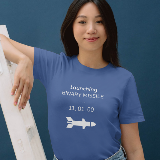 Person wearing a blue t-shirt with a humorous graphic and text against a dark background