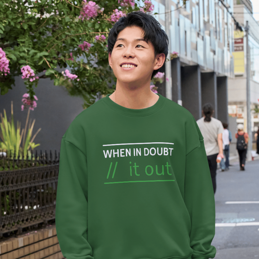 Person wearing a green shirt with text outdoors