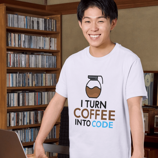 Person wearing a t-shirt with 'I Turn Coffee into Code' design in front of a bookshelf.
