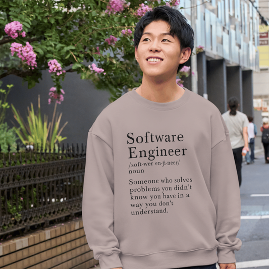 Person wearing a shirt with 'Software Engineer' definition text outdoors.