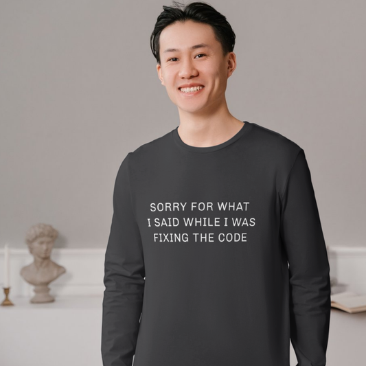 Person wearing a black sweatshirt with text in a room with decorative items.