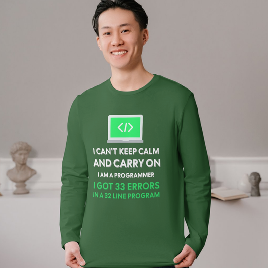 Person wearing a green long-sleeve shirt with text and a logo, standing against a neutral background.